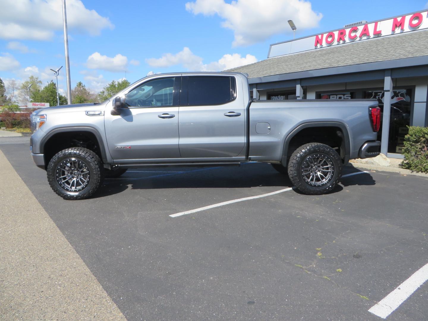 2019 CHARCOAL /BLACK GMC Sierra 1500 AT4 Crew Cab Long Box 4WD (1GTP9EEL6KZ) with an 6.2L V8 OHV 16V engine, 6A transmission, located at 2630 Grass Valley Highway, Auburn, CA, 95603, (530) 508-5100, 38.937893, -121.095482 - Dont miss this AT4 featuring a 4" RC lift kit kit, 35" Nitto Ridge Grappler tires, 20" Fuel Rebel wheels, Amp POwer steps, Air Bags, and a Tyger Bed cover. - Photo#7